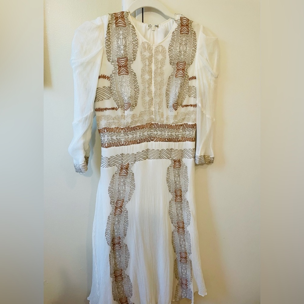 Hand made, beautiful dress. With details of gold, rose gold and silver.